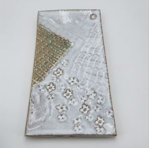 Decorative ceramic tray with pretty details.